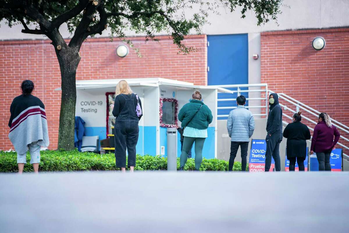 People wait in line at a COVID testing site at the University of Houston-Downtown on Monday. Active COVID-19 cases in Montgomery County jumped more than 1,000 in the last week, pushing the total number of active cases back over 2,200.