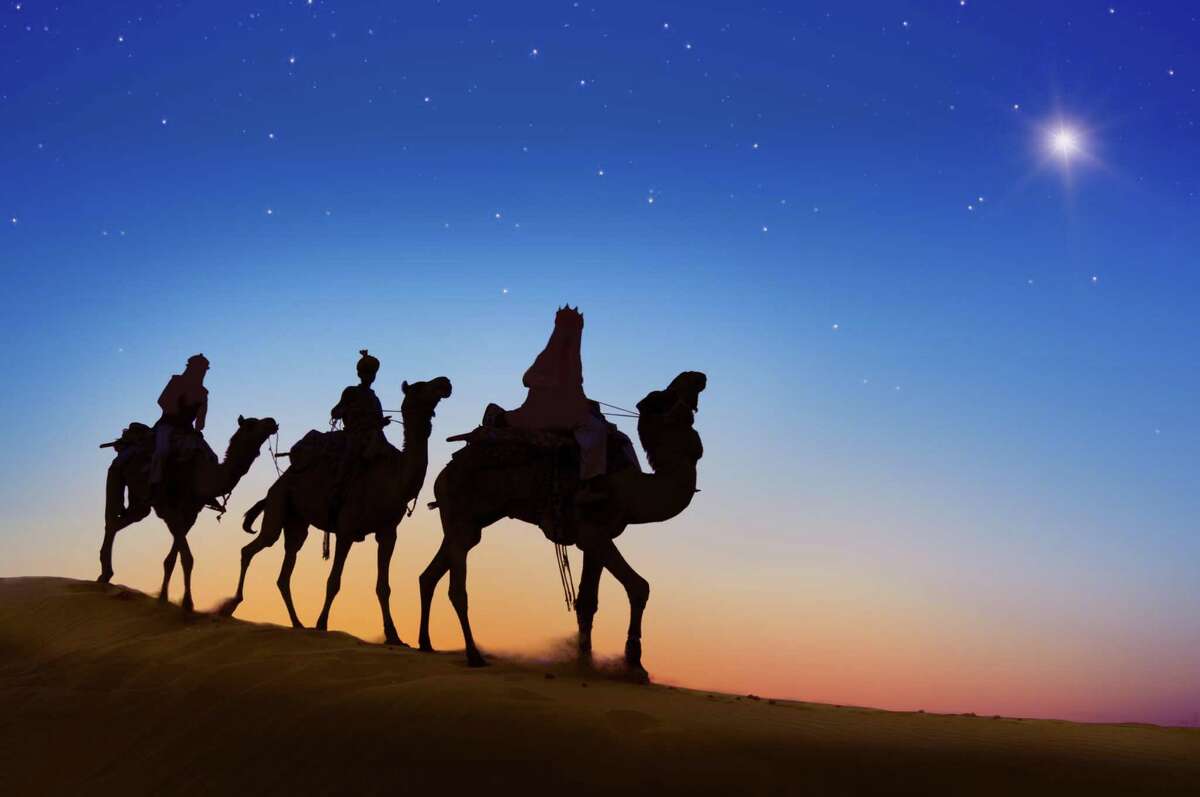 Three Wise Men following the Christmas star.