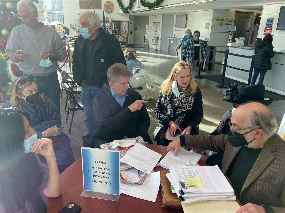 Members of the Stamford Neighborhood Coalition gathered at the Government Center on Dec. 17 to push back on a recently passed zoning text change that encourages the redevelopment of vacant office parks.