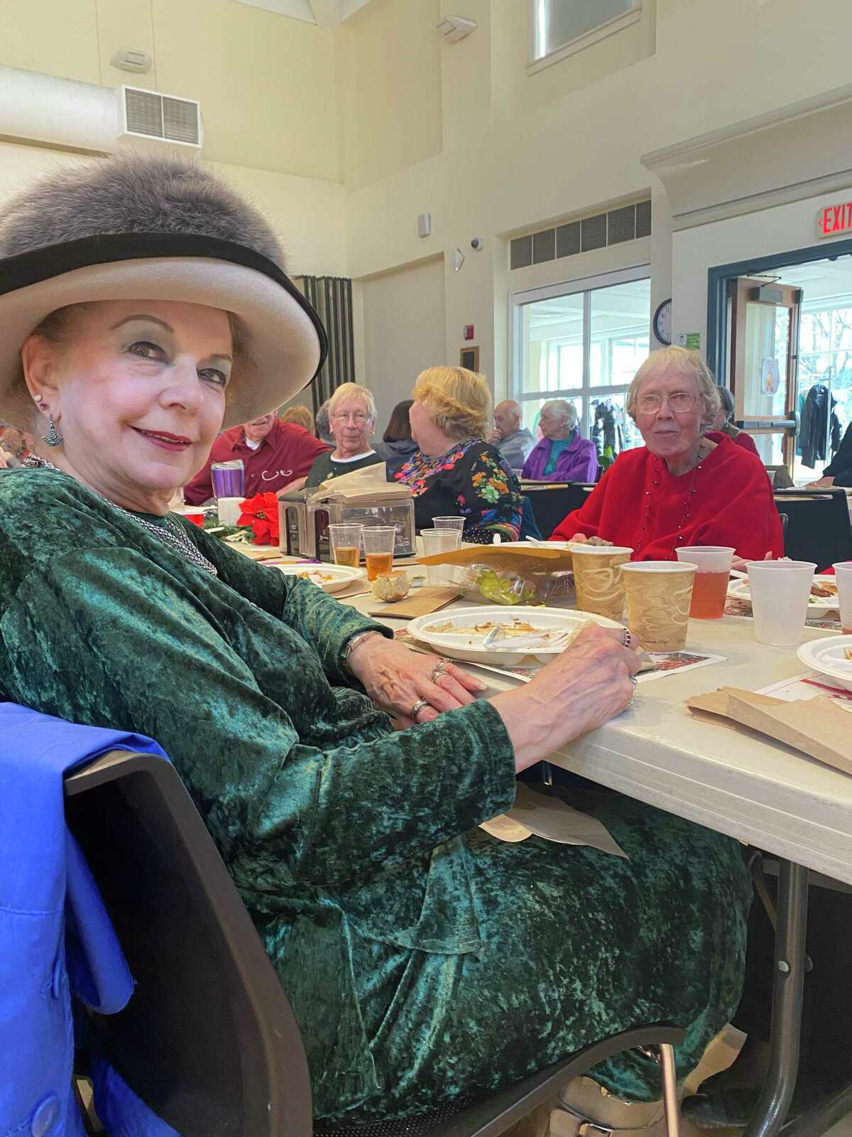 Lucille Jenkins, left, and Brenda Barber, in red, at the annual Guilford seniors’ Christmas lunch on Dec. 17, 2021.