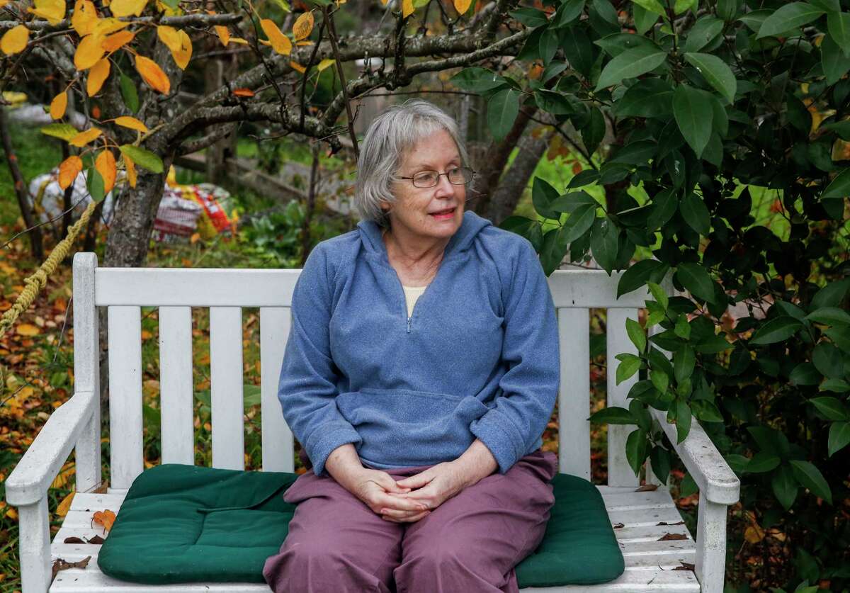 Susan Mulloy sits in the garden of her apartment building in Fairfax. With the help of the Season of Sharing Fund, Mulloy, who lives on a fixed income, was able to move into a rent subsidized senior apartment in January 2020.