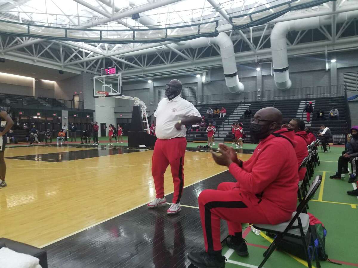 Wilbur Cross boys basketball coach Kevin Walton, left, and assistant coach Gerald McClease look on during the Governors’ 65-62 win over Hillhouse at the Floyd Little Athletic Center on Tuesday.