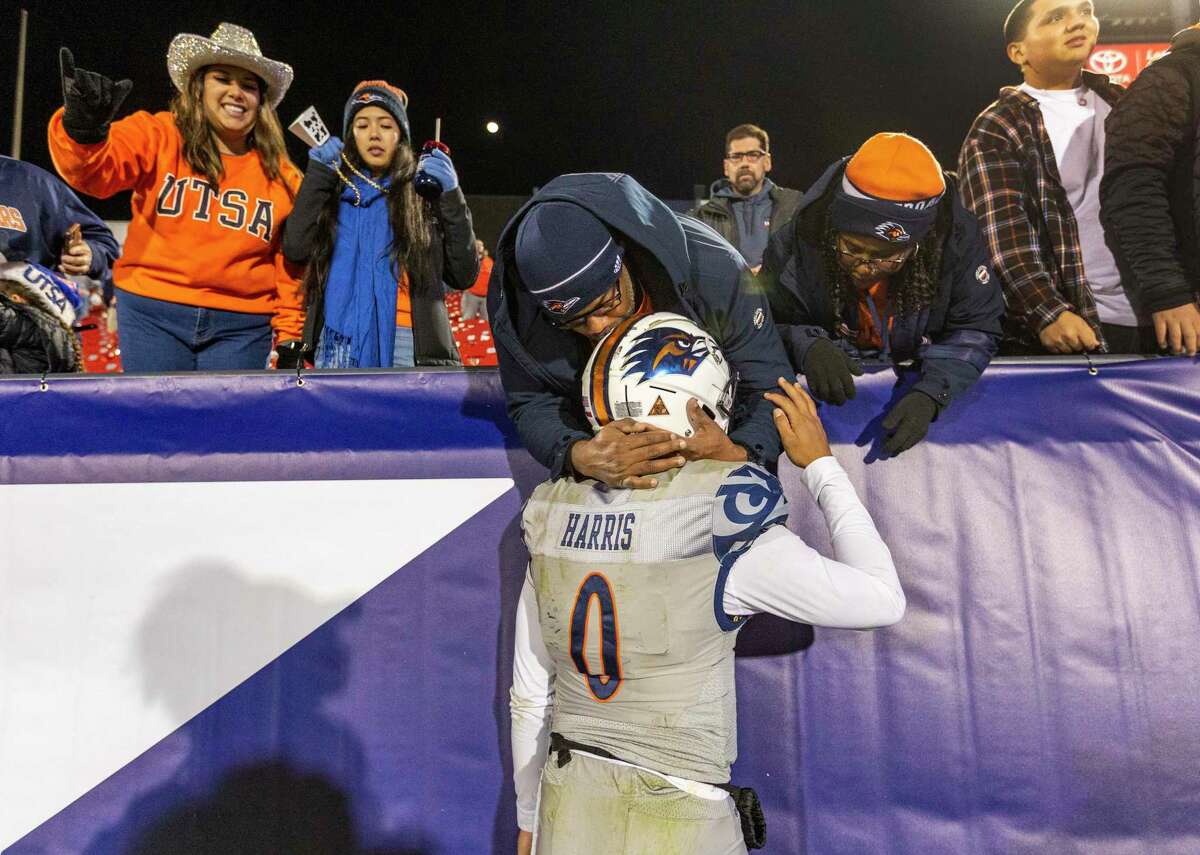 UTSA Roadrunners quarterback Frank Harris gets a hug Tuesday, Dec. 21, 2021 by his parents after the Tropical Smoothie Cafe Frisco Bowl in Frisco, Texas. San Diego State University beat the Roadrunners 38-24.