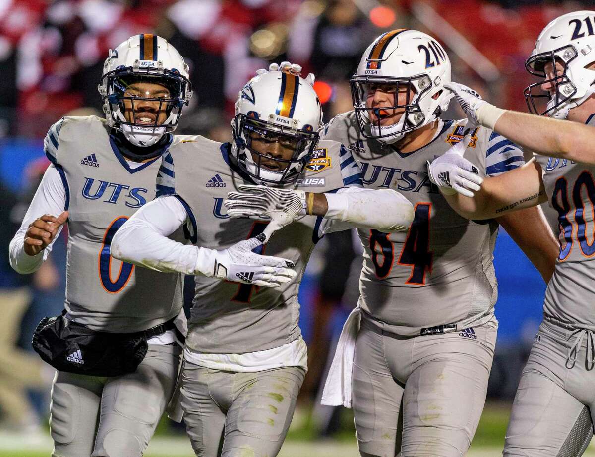 UTSA Roadrunners wide receiver Zakhari Franklin, second from left, celebrates Tuesday, Dec. 21, 2021 a touchdown during the second half of the Tropical Smoothie Cafe Frisco Bowl in Frisco, Texas. San Diego State University beat the Roadrunners 38-24.