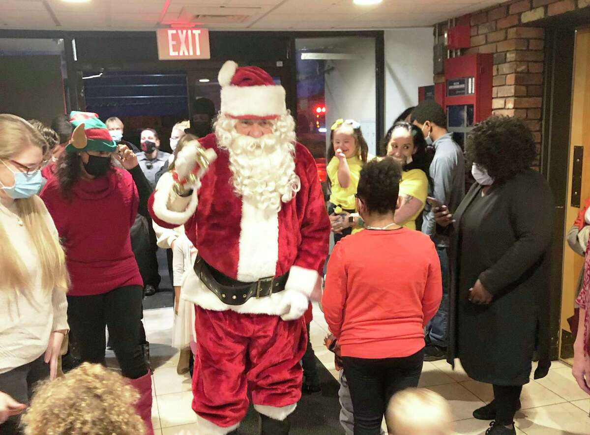 Members of the South Fire District IAFF Local 3918 and Middletown Elks Lodge conducted their annual Adopt-A-Family program celebration Dec. 18. It included a visit from Santa Claus.