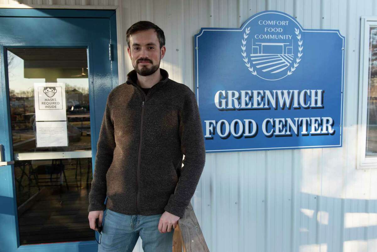 Executive Director Devin Bulger stands outside the Greenwich Food Center, a pantry which is part of Comfort Food Community on Monday, Dec. 13, 2021 in Greenwich, N.Y. Comfort Food Community is a food bank that has grown from a small space in a church to a large operation that includes local farms.
