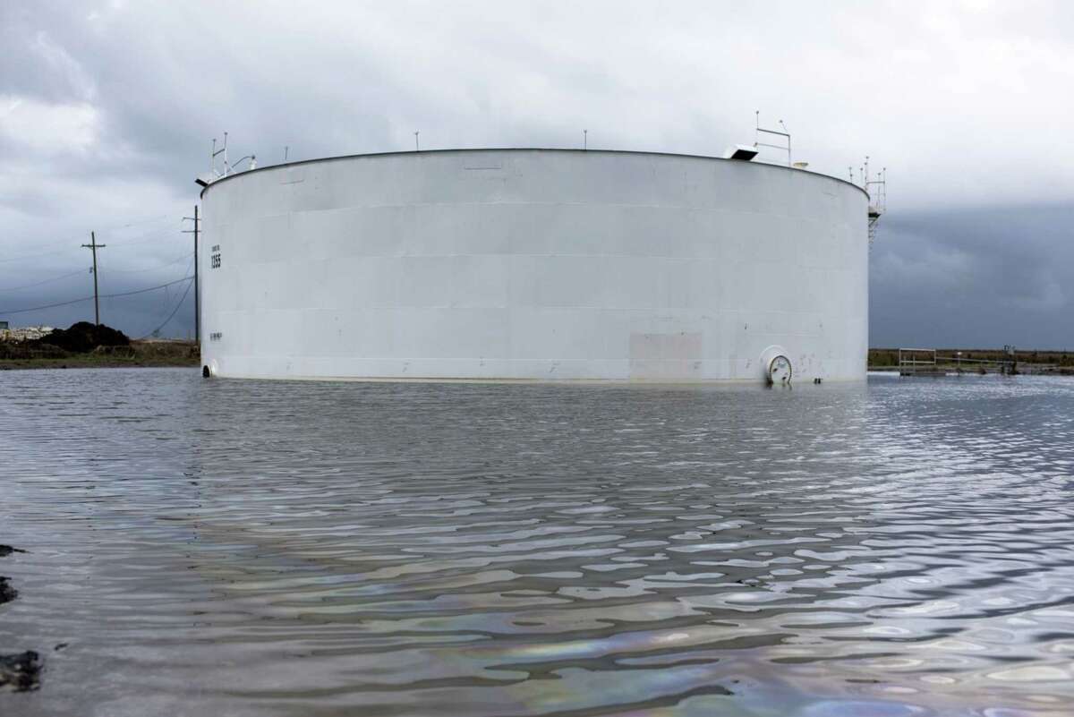 An oil tank surrounded by water after Hurricane Ida near Cocodrie, La., on Sept. 1, 2021. MUST CREDIT: Bloomberg photo by Mark Felix.