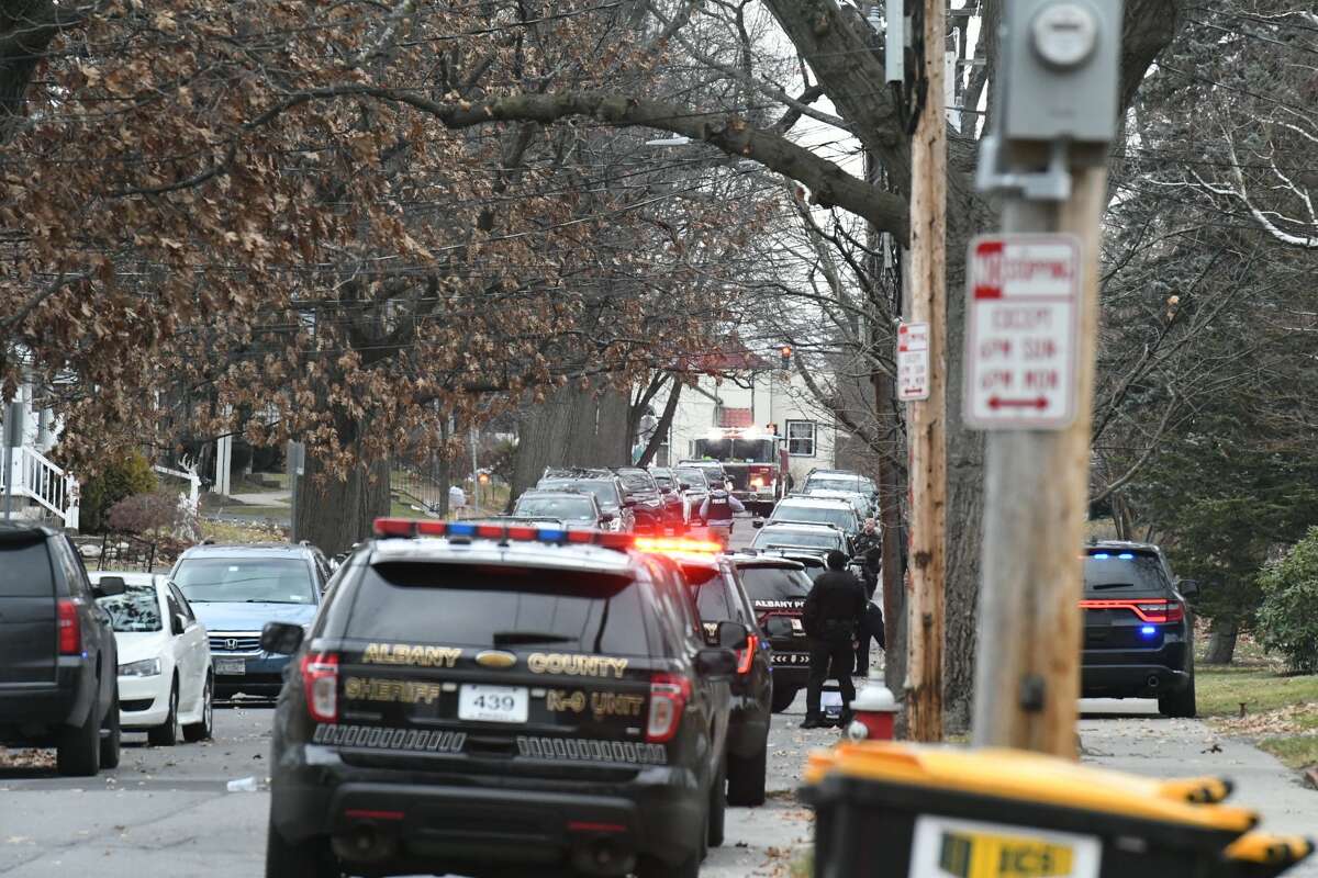 Albany police surrounded a home Wednesday morning on Homestead Avenue and appeared to be trying to communicate with someone inside the structure.