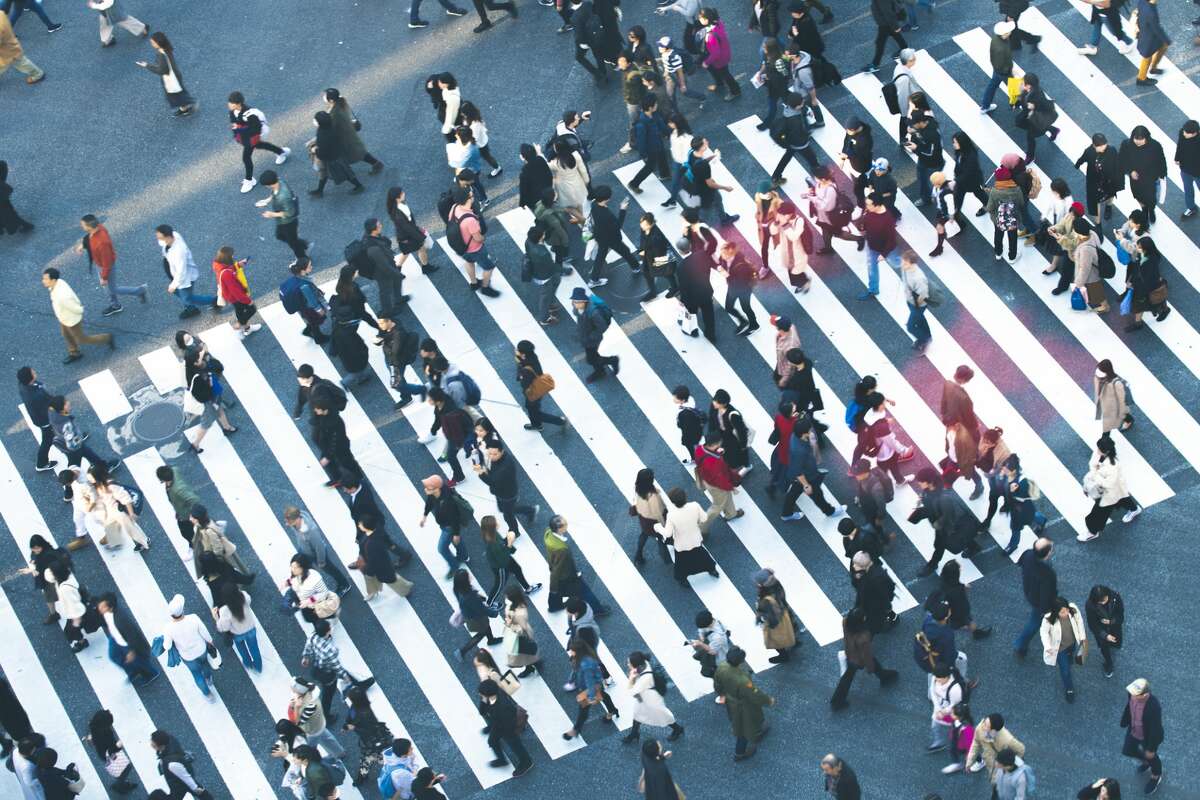 A file image of people crossing a street