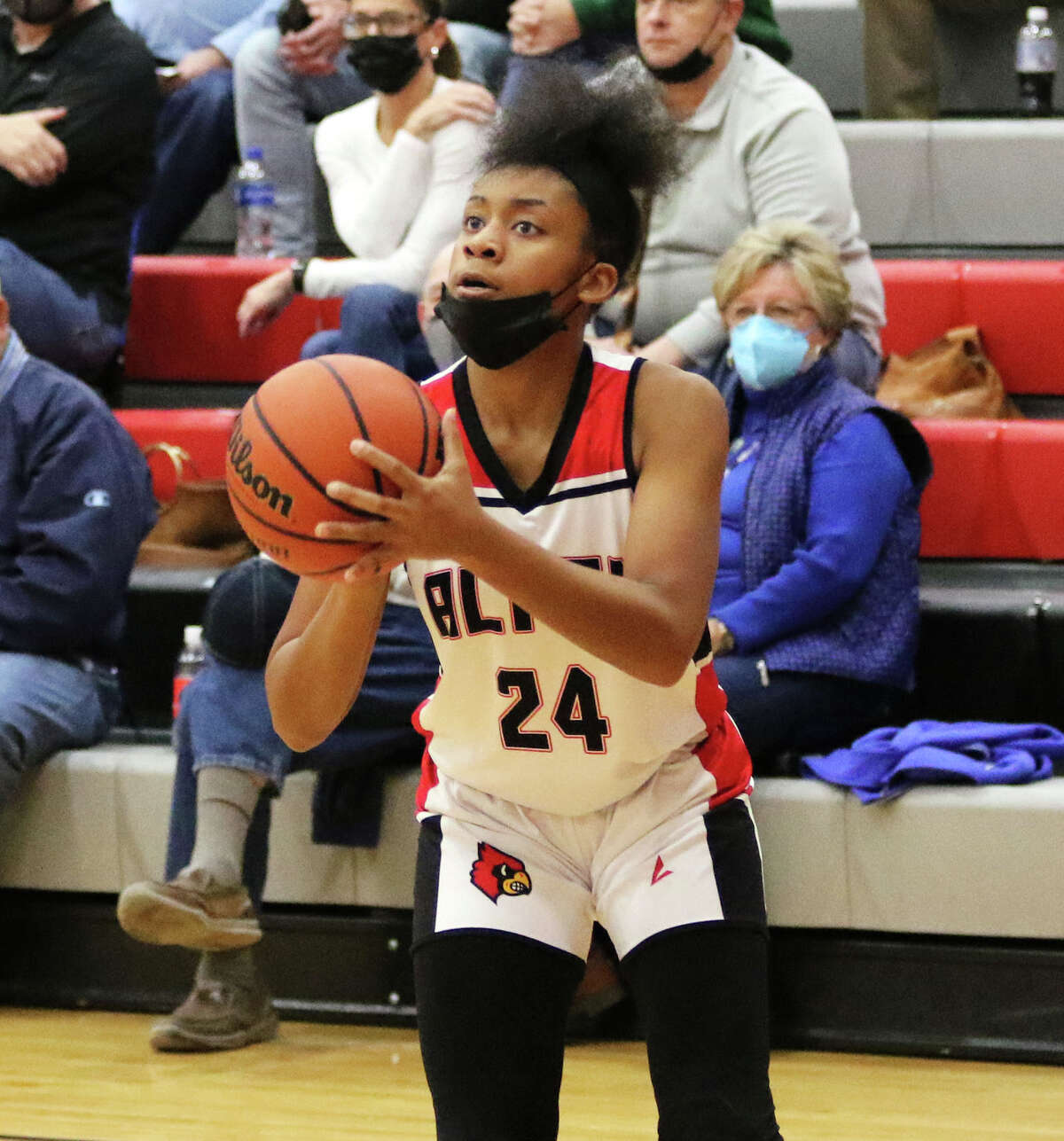 Alton's Laila Blakeny, shown looking to shoot a 3 in a home game earlier this season, scored 15 points Tuesday night in the Redbirds' win at Quincy. 