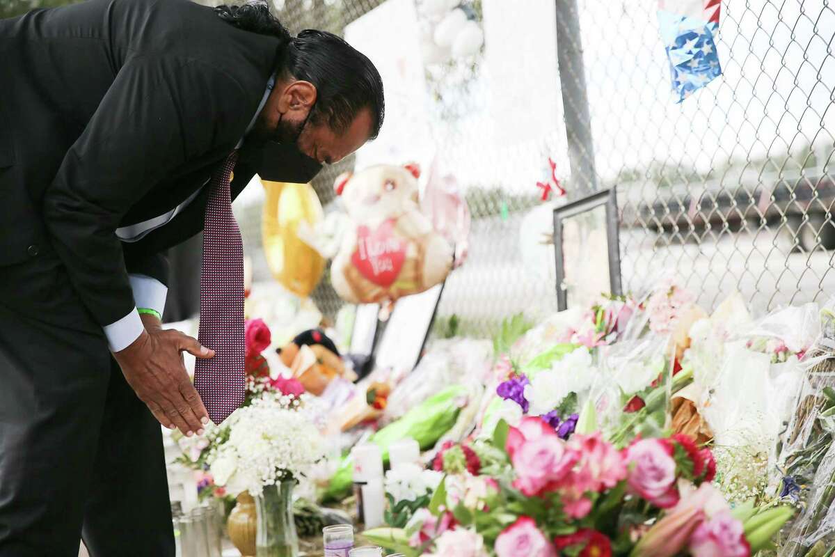 U.S. Rep. Al Green places flowers on a memorial at Westridge and Kirby in honor of the victims of the tragedy at last weekend’s Astroworld Festival on Tuesday, Nov. 9, 2021 in Houston.