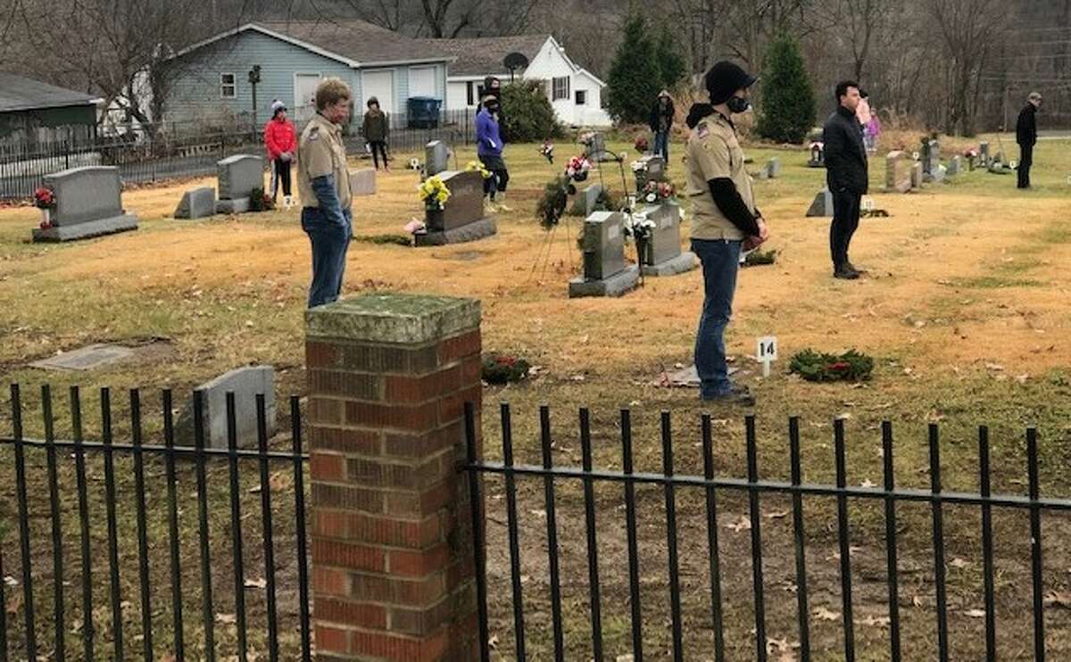 Boys Scouts and 4-H volunteers helped the Genl. George Rogers Clark Sons of the American Revolution chapter present its Wreaths Across America event on Dec. 11.