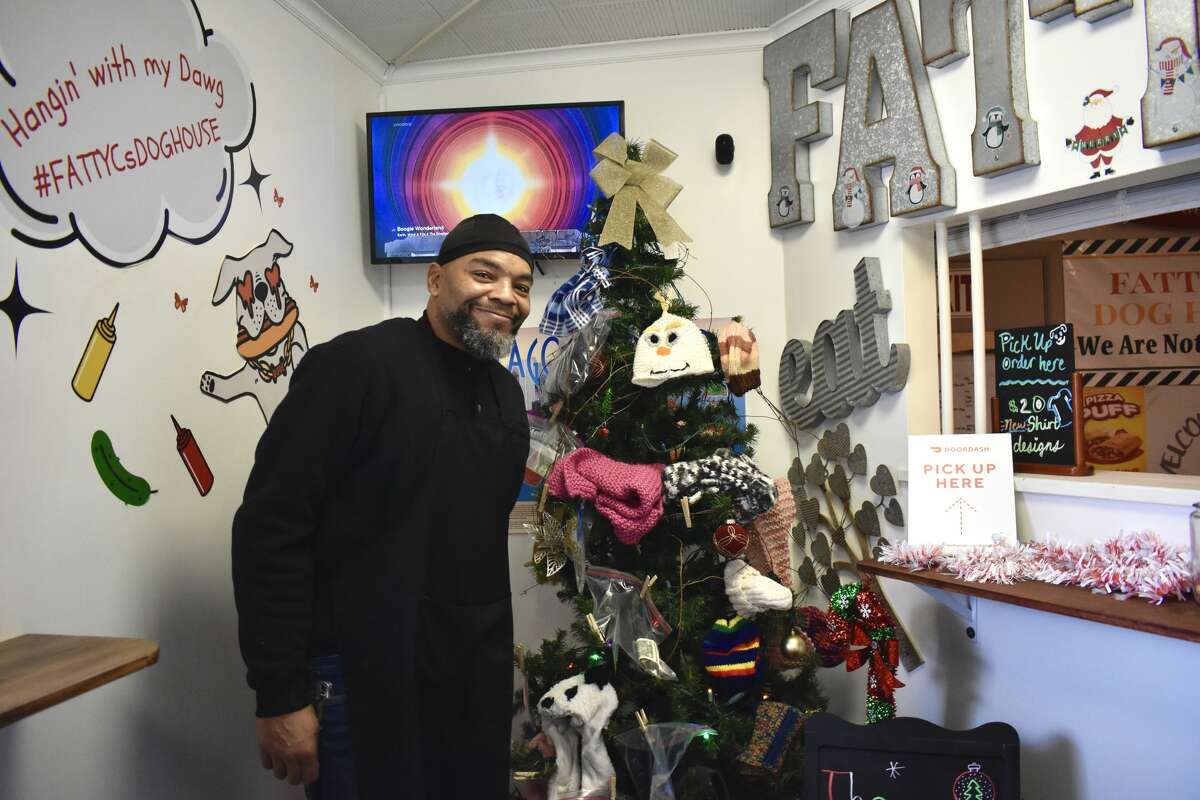 Bernard Agee, owner of Fatty C's Dog House, recently put up a 'giving tree' to help people in need during the holiday season filled up with hand-knitted, colorful hats, gloves and scarves for the taking. 