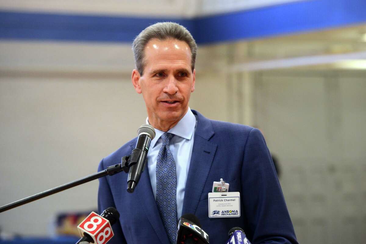 Pat Charmel, President and CEO of Griffin Hospital speaks during a rededication ceremony in the newly renovated Ansonia Armory gymnasium, in Ansonia, Conn. Dec. 22, 2021.