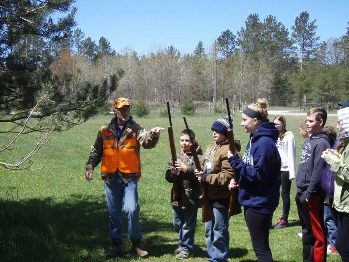 Dave Somsel (left) instructs students on gun safety at the Big Bear Sportsman's Club in Kaleva. 