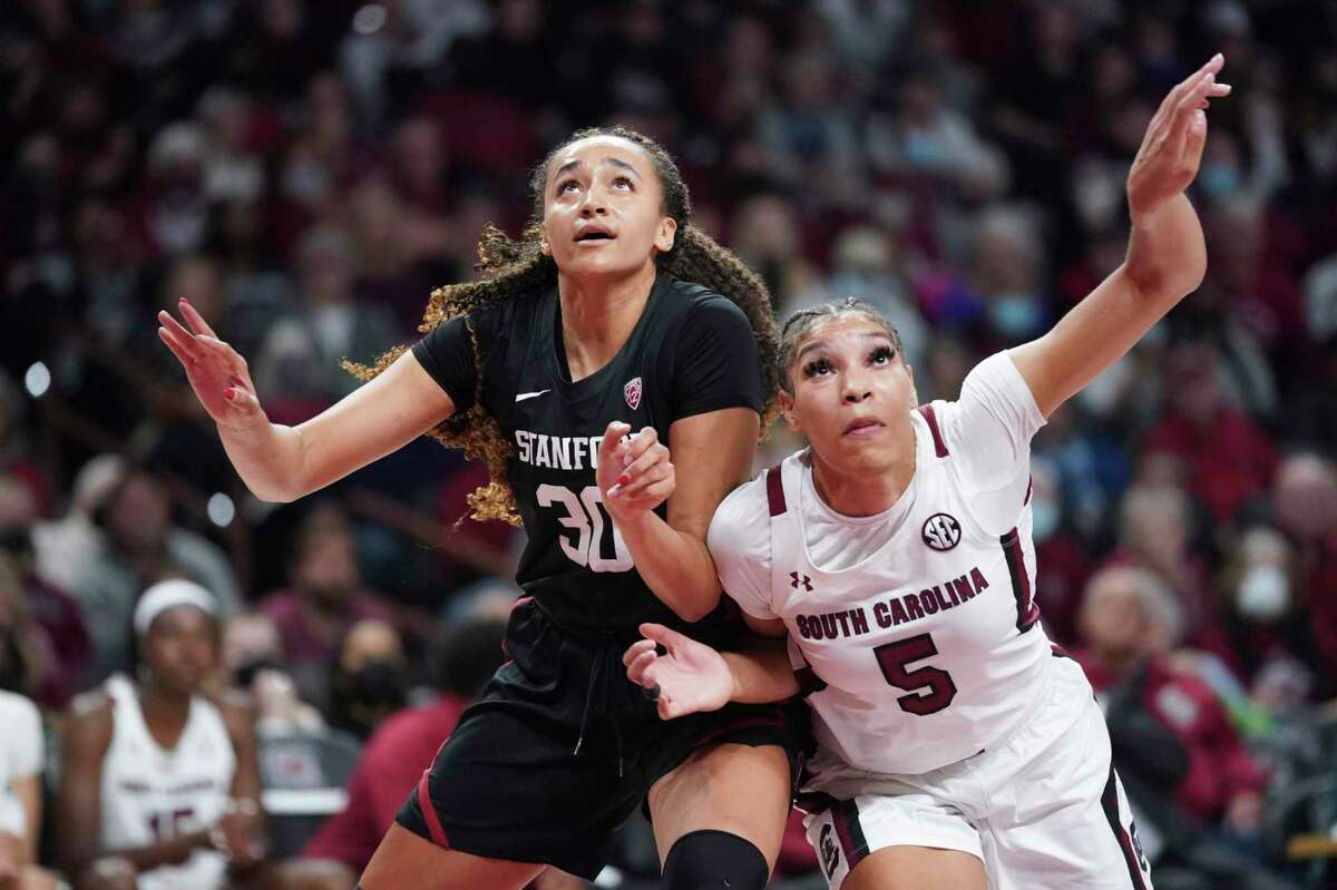 South Carolina forward Victaria Saxton (5) and Stanford guard Haley Jones (30) battle for rebound position during the second half of an NCAA college basketball game Tuesday, Dec. 21, 2021, in Columbia, S.C. South Carolina won 65-61. (AP Photo/Sean Rayford)
