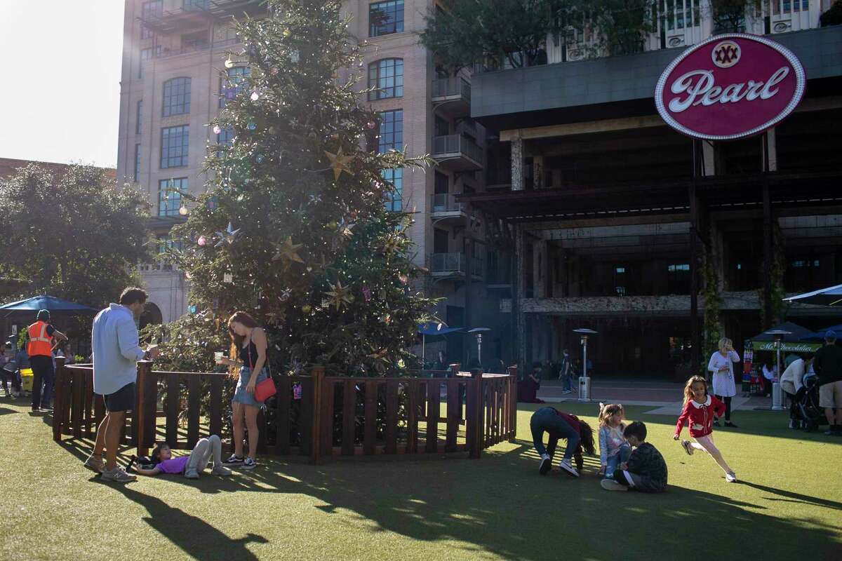 People soak up the sunshine at Pearl Brewery on Dec. 22, 2021. San Antonio experienced one of its warmest Decembers on record in 2021.