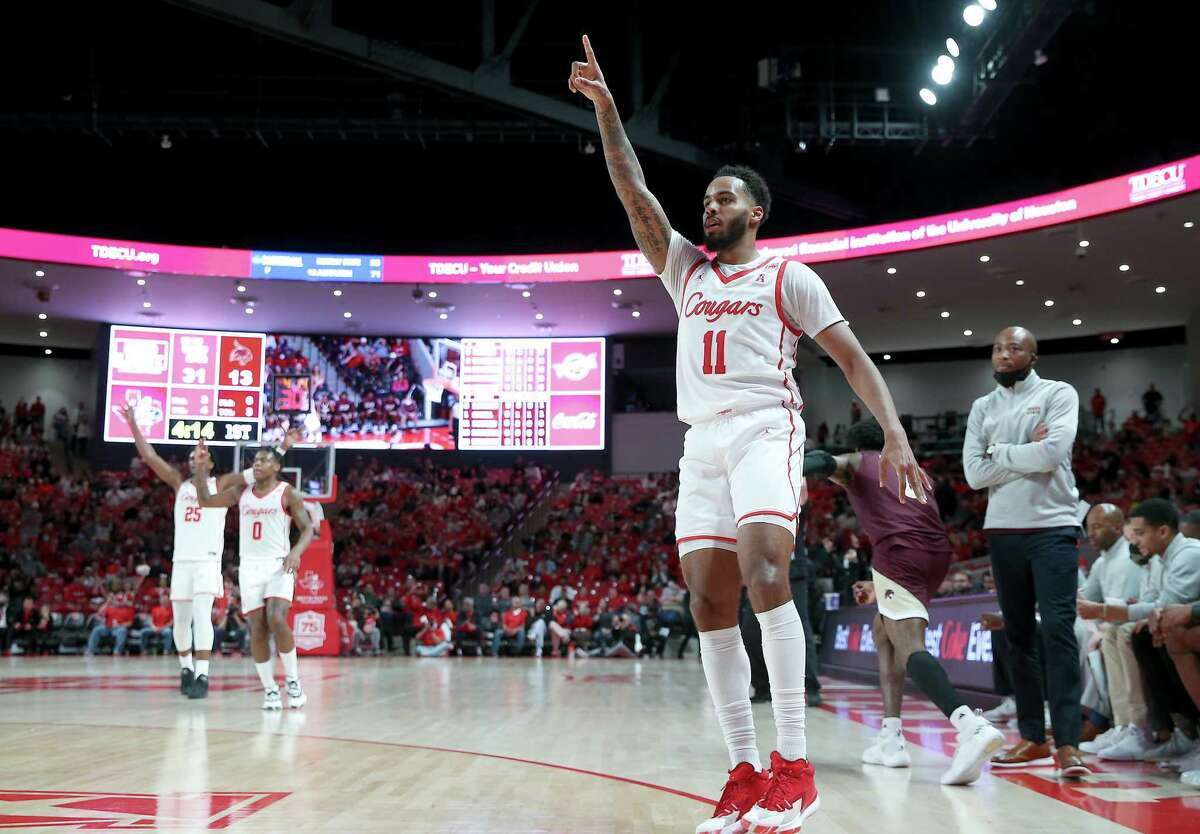 Houston Cougars guard Kyler Edwards (11) reacts to sinking a three-point shot against the Texas State Bobcats at the Fertitta Center in Houston on Wednesday, Dec. 22, 2021.