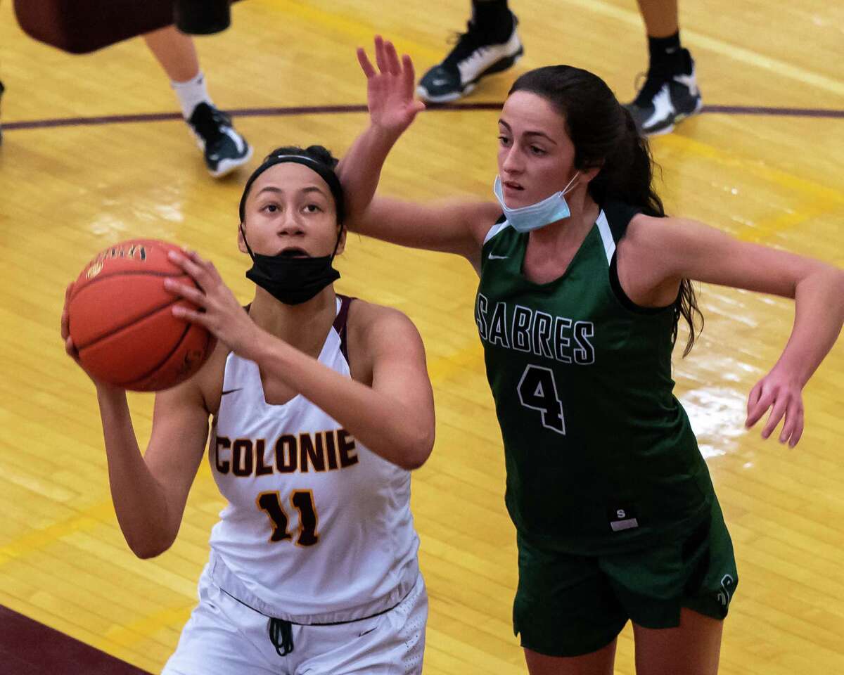 Colonie junior Jayla Tyler drives to the basket in front of Schalmont defender Payton Graber during a non-league matchup at Colonie High School on Wednesday, Dec. 22, 2021. (Jim Franco/Special to the Times Union)