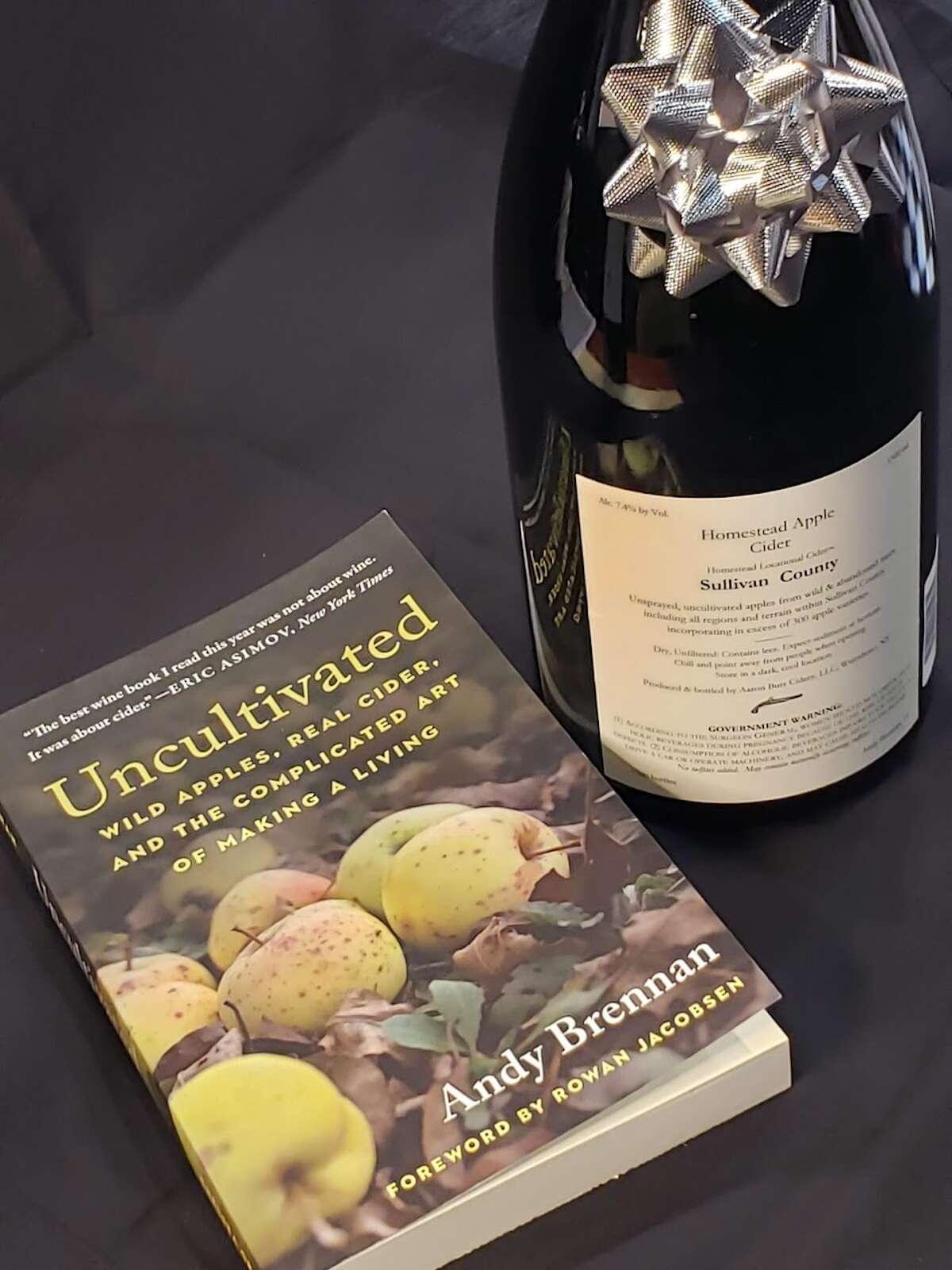 Flori likes to pair a magnum of the Aaron Burr Homestead Cider with the cider maker's book, "Uncultivated."