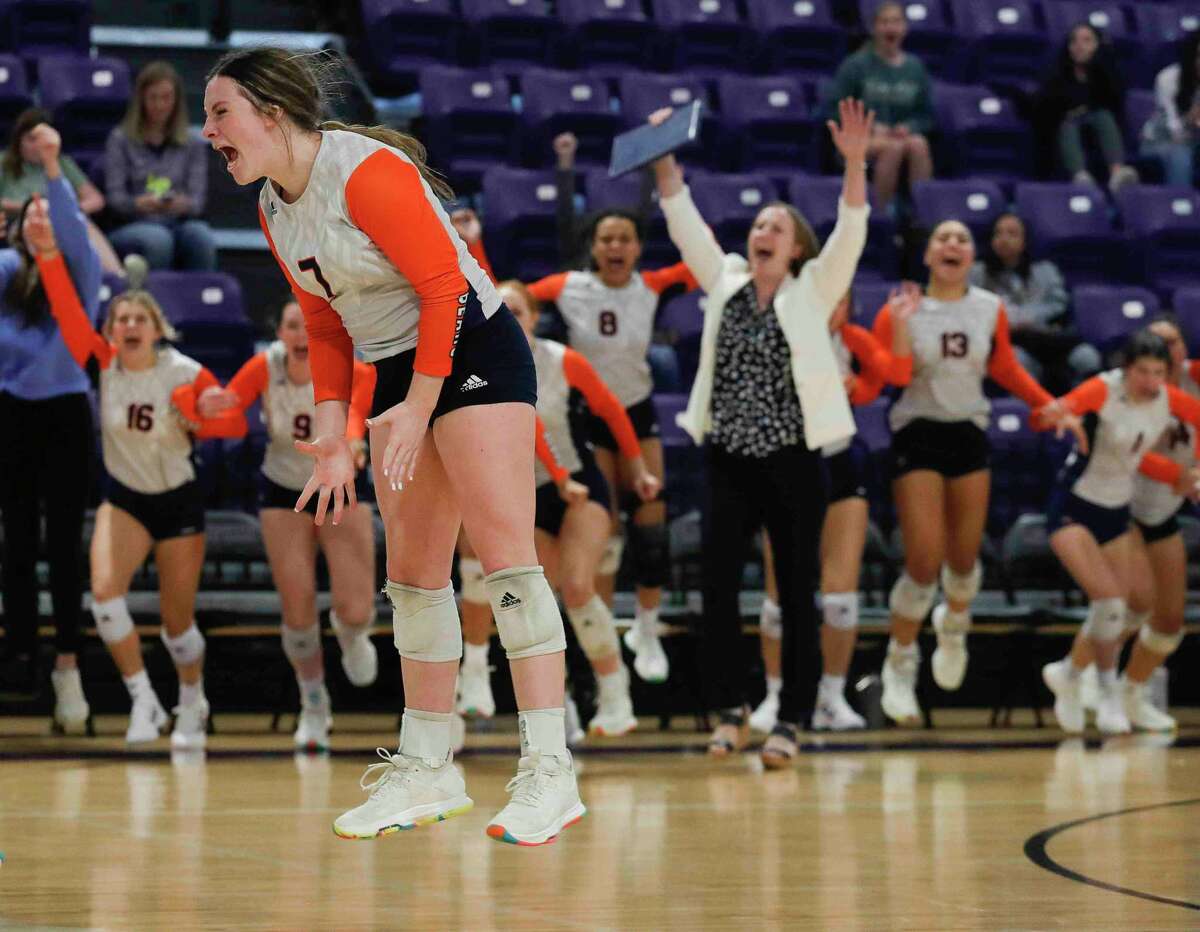 Bridgeland outside hitter Grace Orlando (7) celebrates with setter Brooke Adams (18) after defeating The Woodlands in five sets to advance to the program’s first state tournament, Saturday, Nov. 13, 2021, in Lufkin.