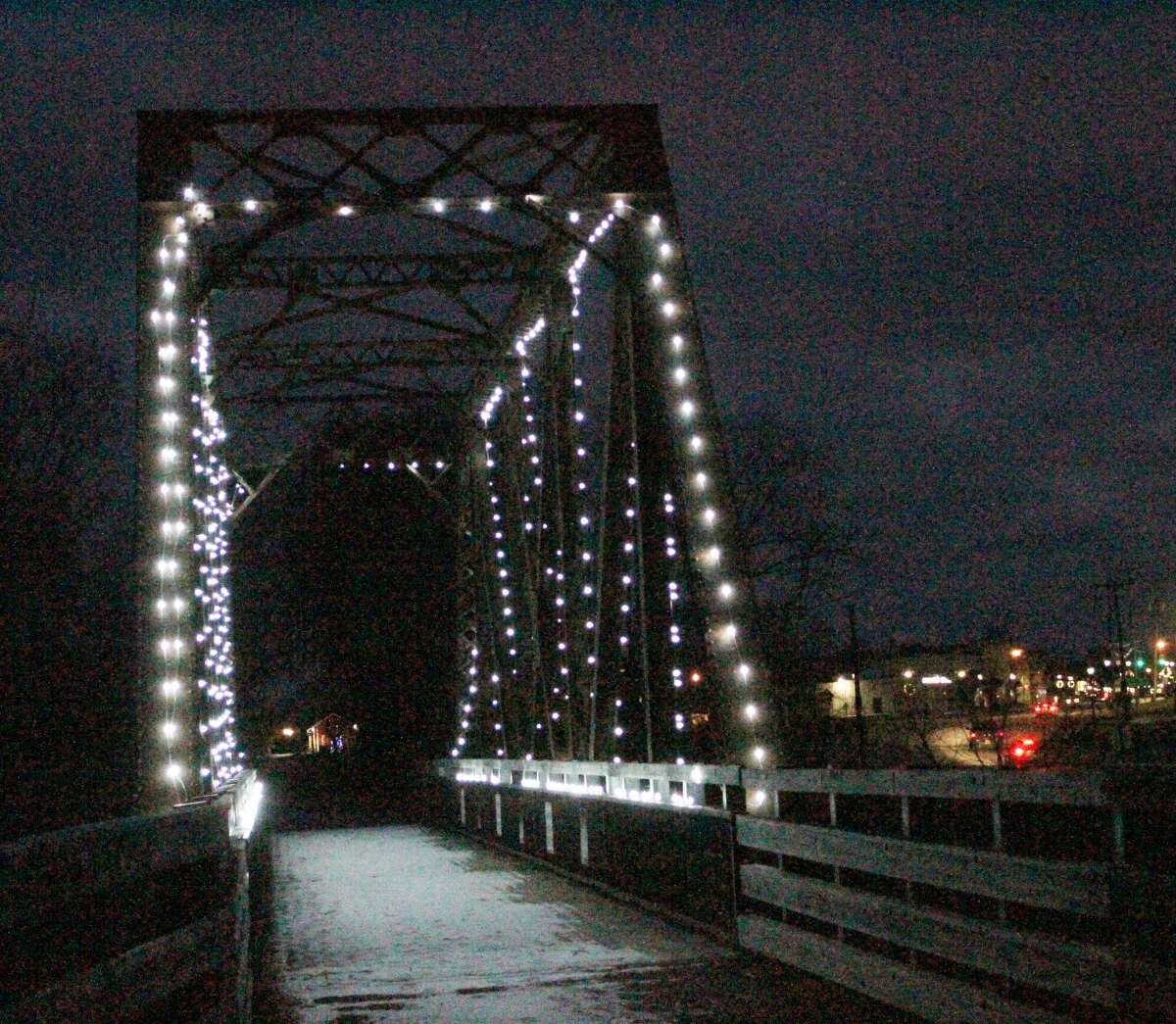 The Evart Railroad Bridge illumates the Pere Marquette Rail Trail on a recent cold evening.