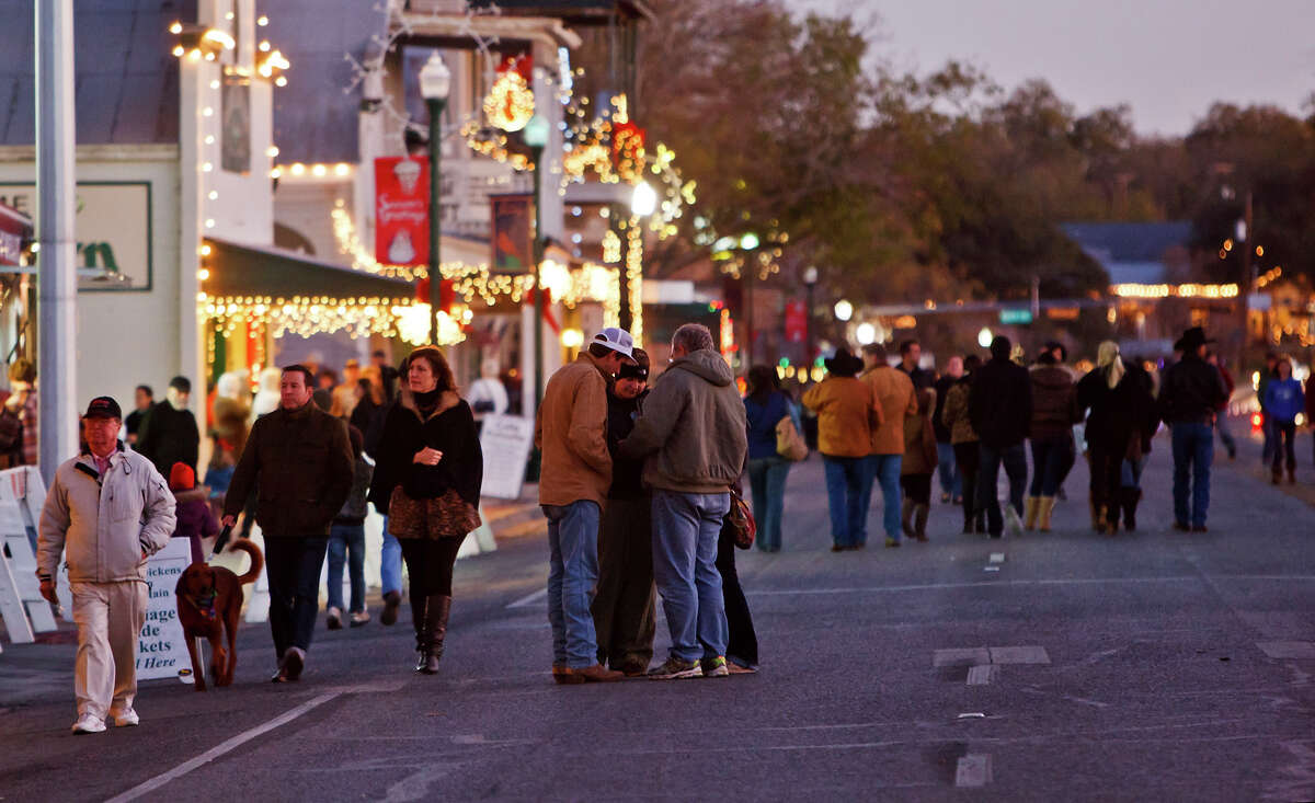 People make their way down Main Street during Boerne's annual Dickens on Main celebration on Nov. 26, 2011. 