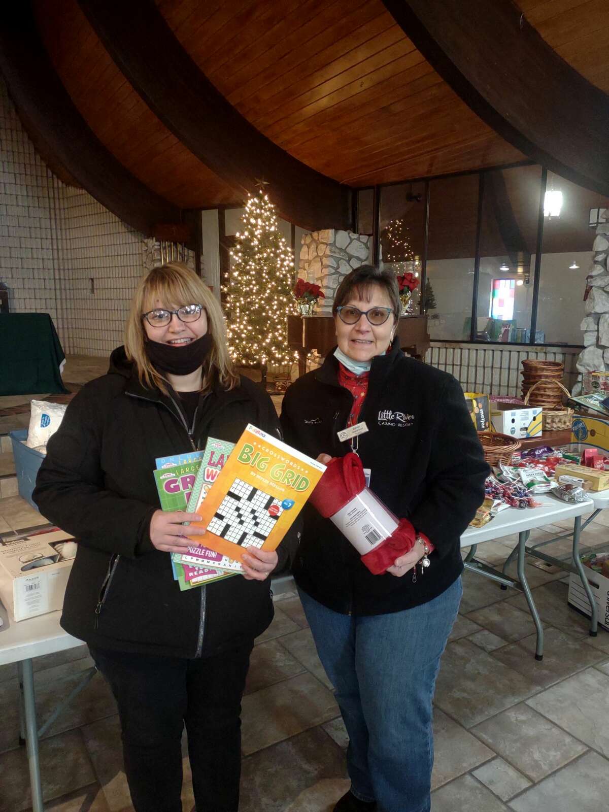 Members of the purchasing & warehouse teams at Little River Casino Resort worked together to purchase gifts for the senior center's Christmas Gifts for Homebound Seniors program.