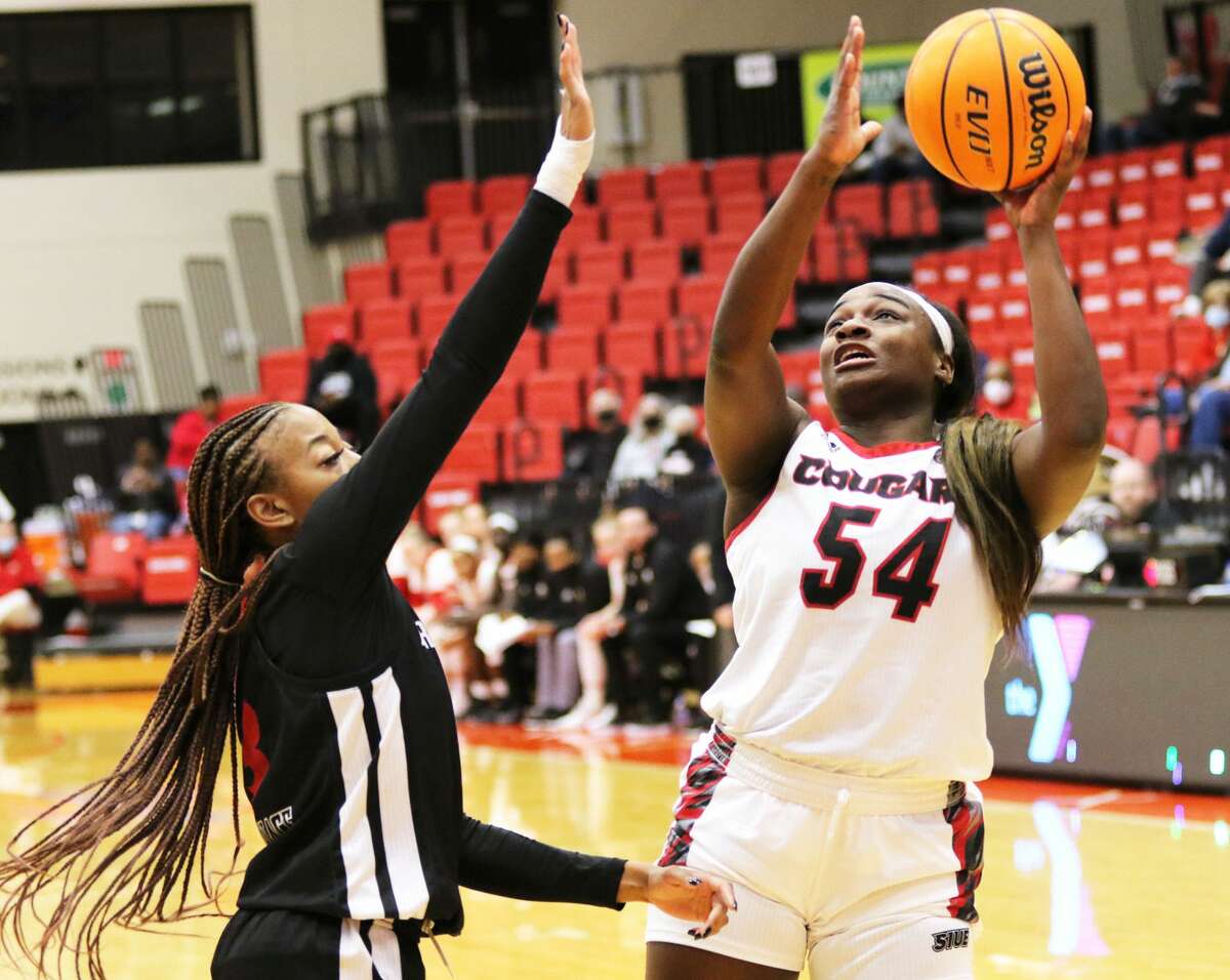 SIUE's Kelsie Williams (54) shoots over Arkansas State's Morgan Wallace in the first half of Wednesday night's college women's basketball game at First Community Arena in Edwardsville.