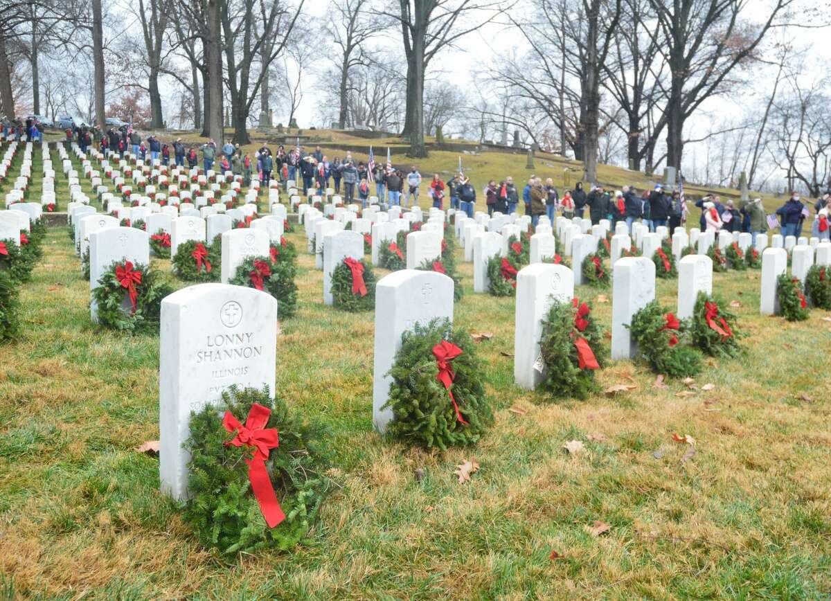 Alton's Wreaths Across America saw the joining of veterans and local students placing wreaths on tombstones at Alton National Cemetery of those fallen during a service on Saturday, Dec. 18.
