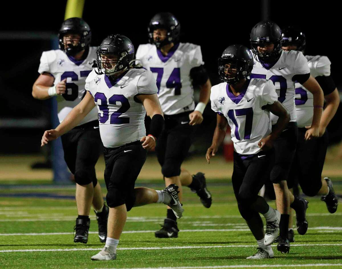 Fulshear running back Seth Smith (32) reacts after scoring a 3-yard touchdown during the second quarter of a high school football game, Friday, Sept. 24, 2021, in Montgomery.