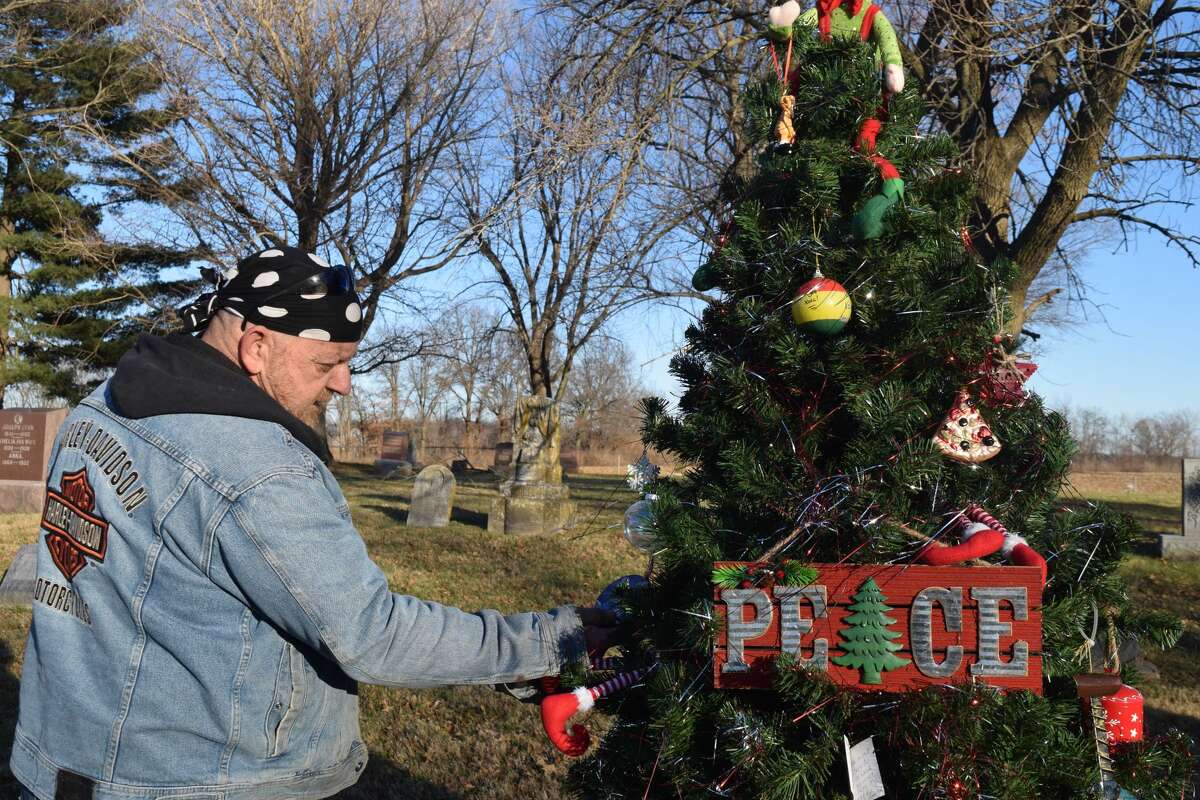 Steve Wild decorates his son's gravesite each season and, during the holidays, asks friends and family to add ornaments to his Christmas tree.