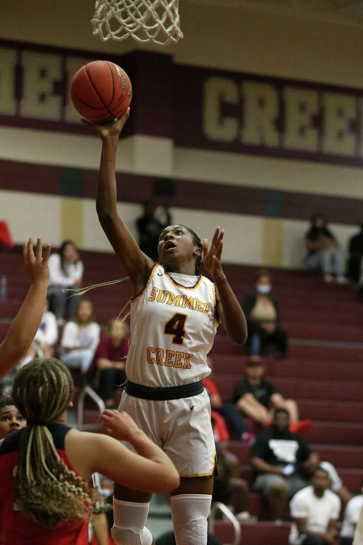 Summer Creek Bulldogs forward Kaitlyn Duhon #4 shoots the ball during the first half of the high school basketball game between the Summer Creek Bulldogs and the Atascocita Eagles at Summer Creek High School in Houston, TX on Friday, December 17, 2021.