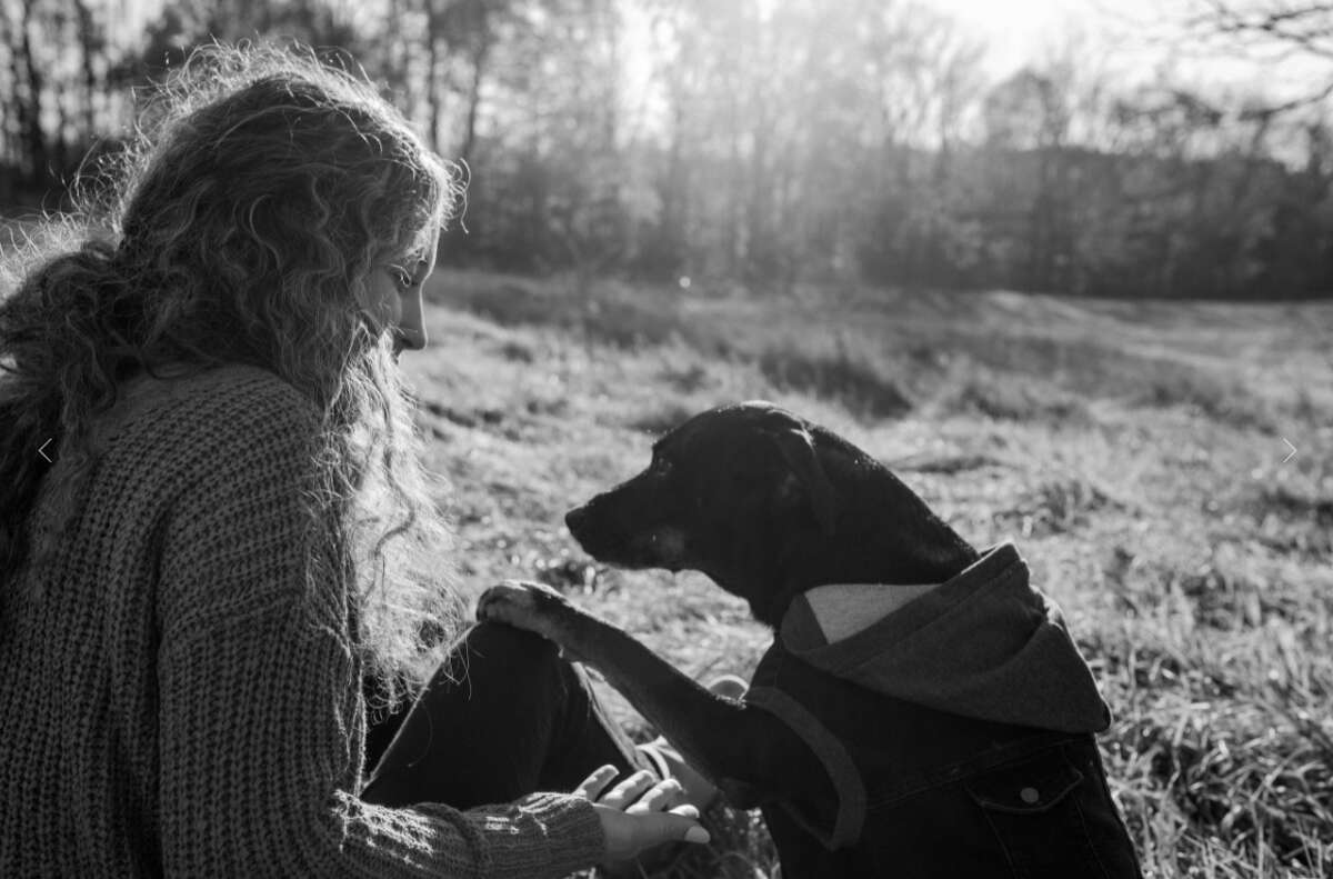 Earhart's photos show the undying love and affection between dogs and their owners.