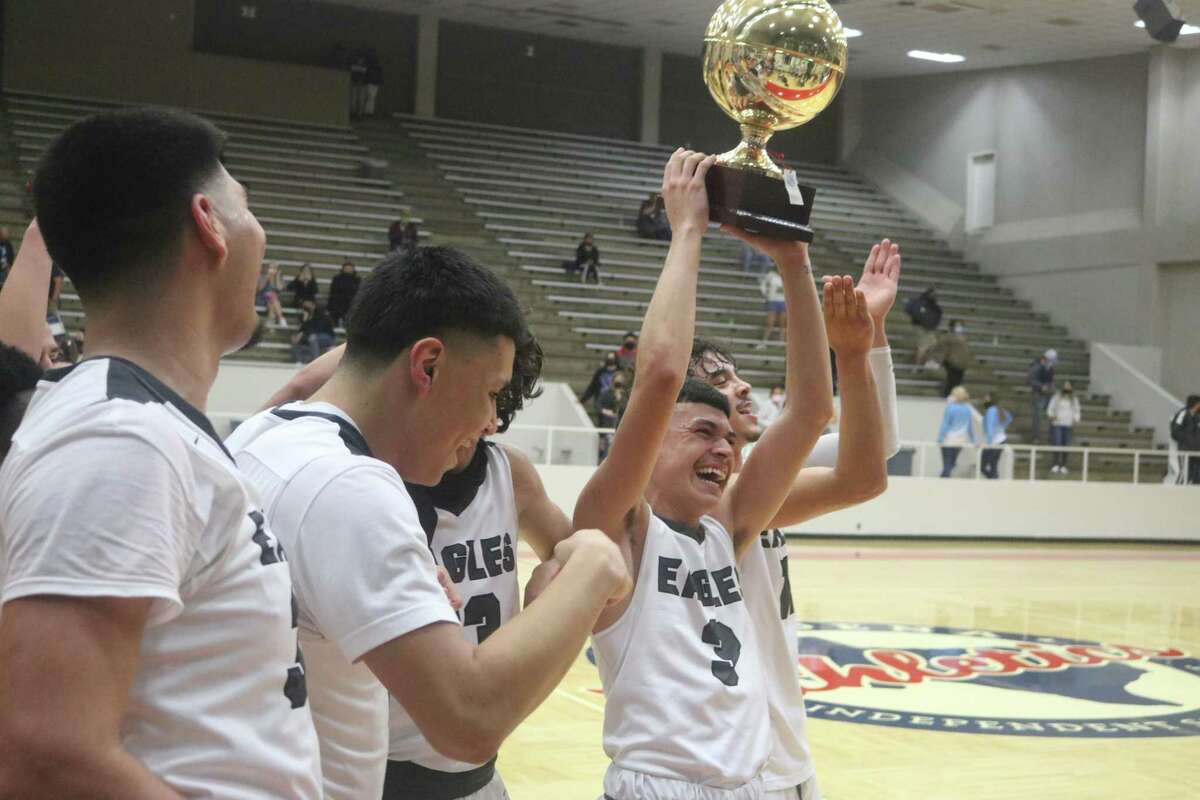 A sight we never thought we'd see — in February, members of the Pasadena Eagles hold aloft the District 22-6A basketball championship trophy at Phillips Fieldhouse.