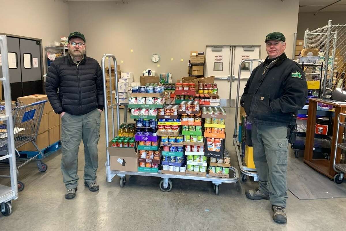 About 1,660 pounds of food is donated to Ludington Lakeshore Food Club by the Michigan Department of Natural Resources Ludington State Park staff, Jim Gallie and Kevin Swygert.