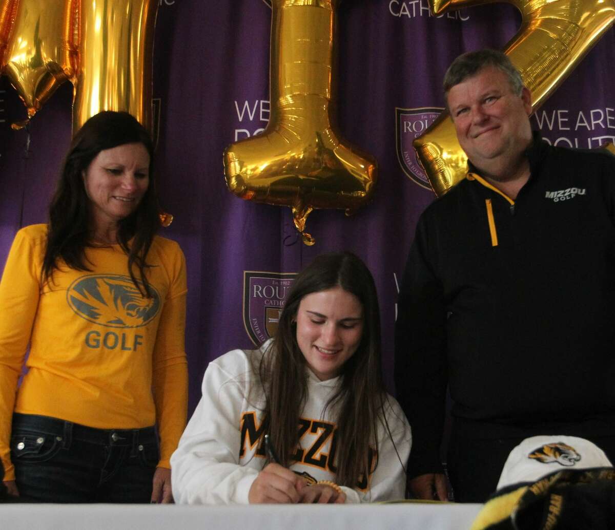 Routt's Addie Dobson signs a letter of intent to play golf at Missouri as her mom, Dena, and dad, Kenny, look on at Routt earlier this year.