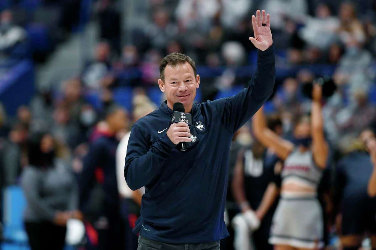 New Connecticut football head coach Jim Mora is introduced at an NCAA college basketball game between Connecticut and Arkansas, Sunday, Nov. 14, 2021, in Hartford, Conn. (AP Photo/Jessica Hill)