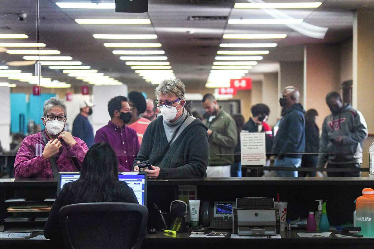 People visit the Texas Department of Public Safety’s Driver License Center at the Leon Valley Mega Center on Monday, Dec. 20, 2021.