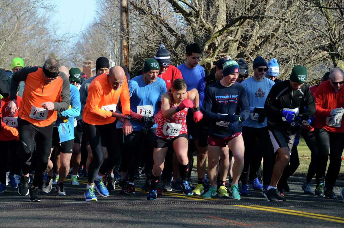 Runners take off Sunday for the 2019 Milford Road Runners’ five-mile Winter Wonderland run.