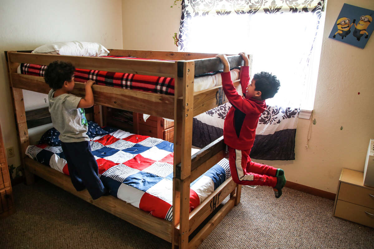 Javeon and Kassius Northern enjoy their new bunk bed provided by the Sleep in Heavenly Peace organization Saturday, Dec. 11, 2021 in Midland.