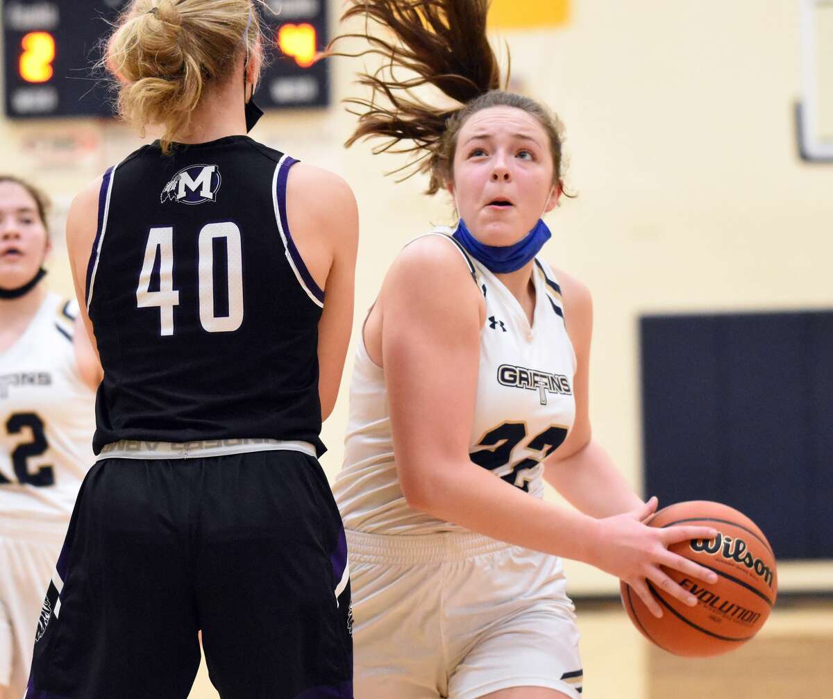 Father McGivney's Charlize Luehmann drives to the basket in the second quarter against Mascoutah on Thursday in Glen Carbon.