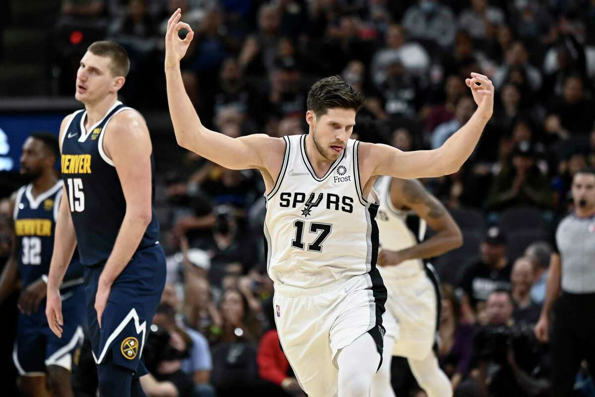 San Antonio Spurs' Doug McDermott (17) celebrates a 3-point basket during the first half of an NBA basketball game against the Denver Nuggets, Thursday, Dec. 9, 2021, in San Antonio. San Antonio won 123-111.