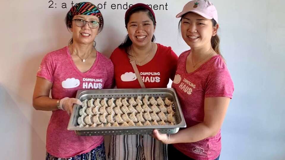 From left: Elaine Won, Ashley Lai and Amiley Lai with their staple dumplings at Dumpling Haus in Houston.