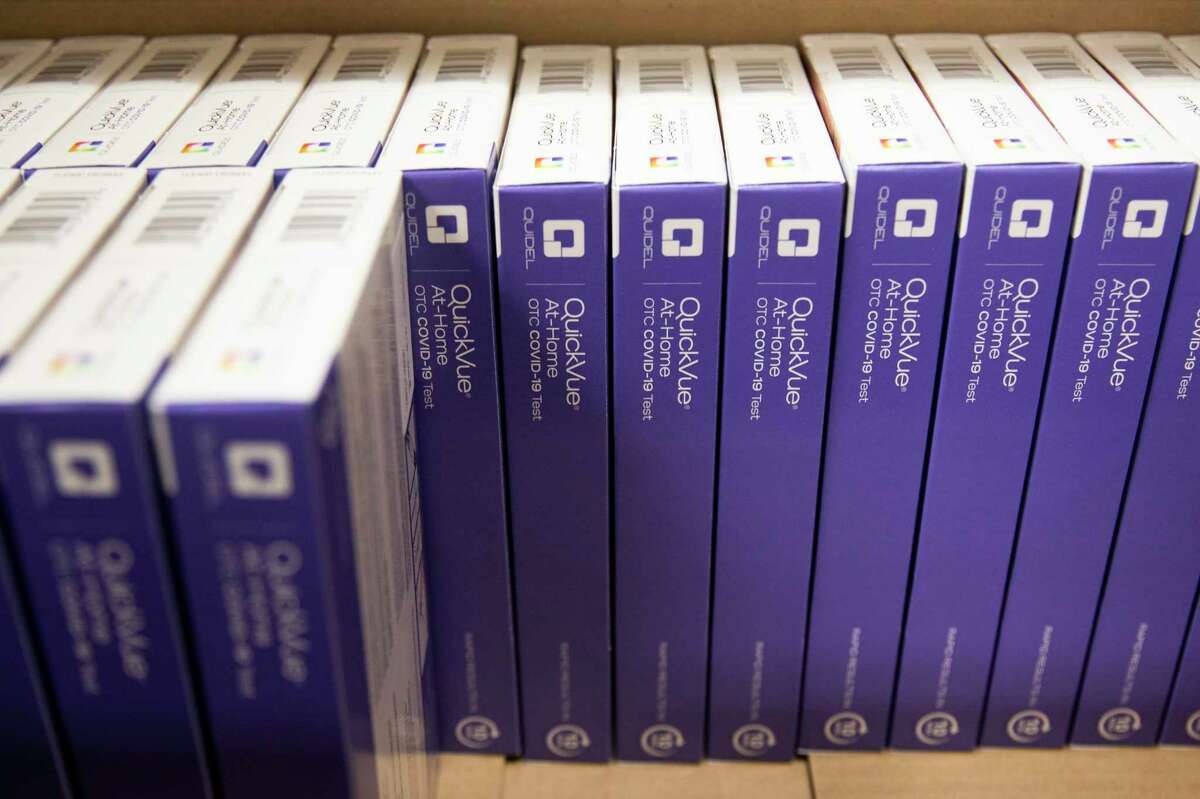 Free rapid COVID-19 test kits sit in a box as they wait to be handed out to residents at Contra Costa County Supervisor John Gioia’s office in El Cerrito, Calif. on Dec. 21, 2021.