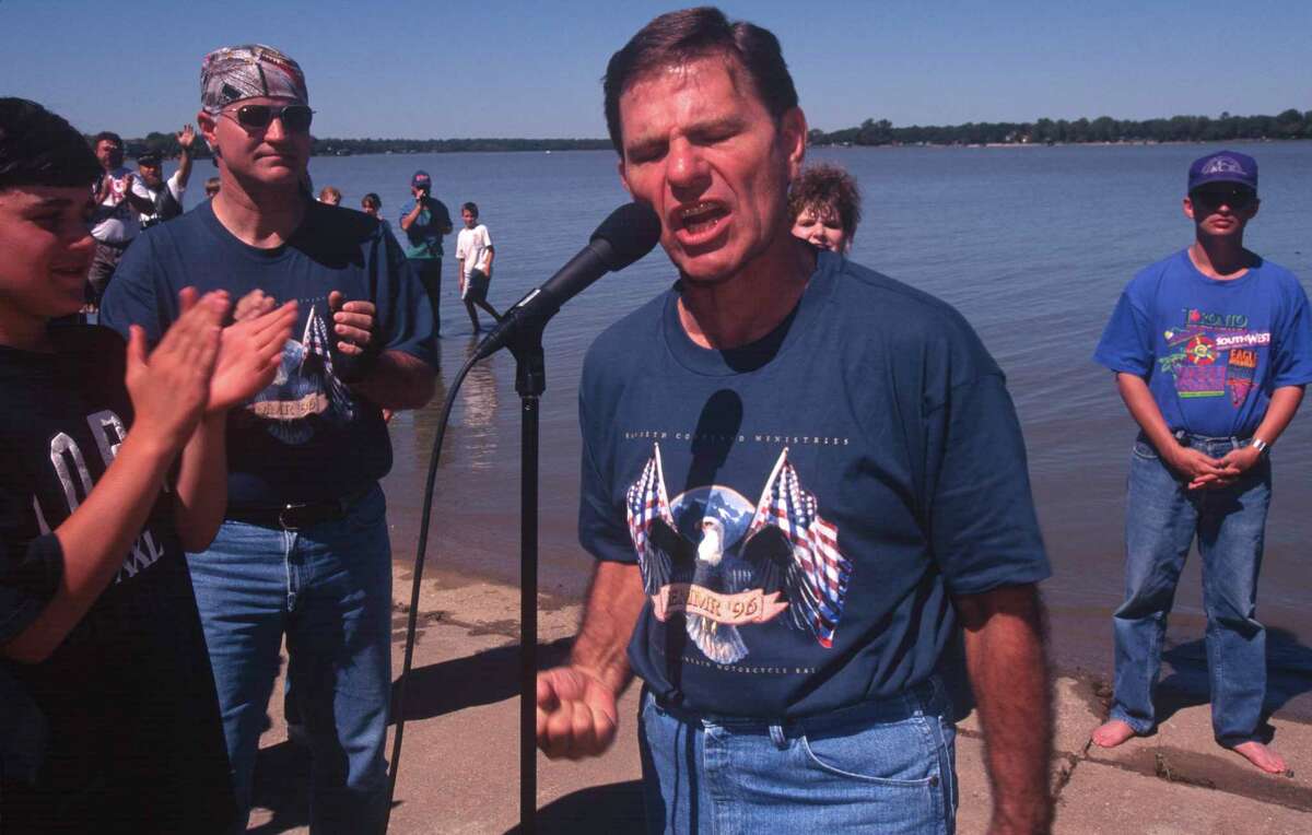 Kenneth Copeland prays at an annual evangelical motorcycle rally on his Eagle Mountain Lake property on Sept. 28, 1996 in Newark. His church-owned parsonage was built in 1999.