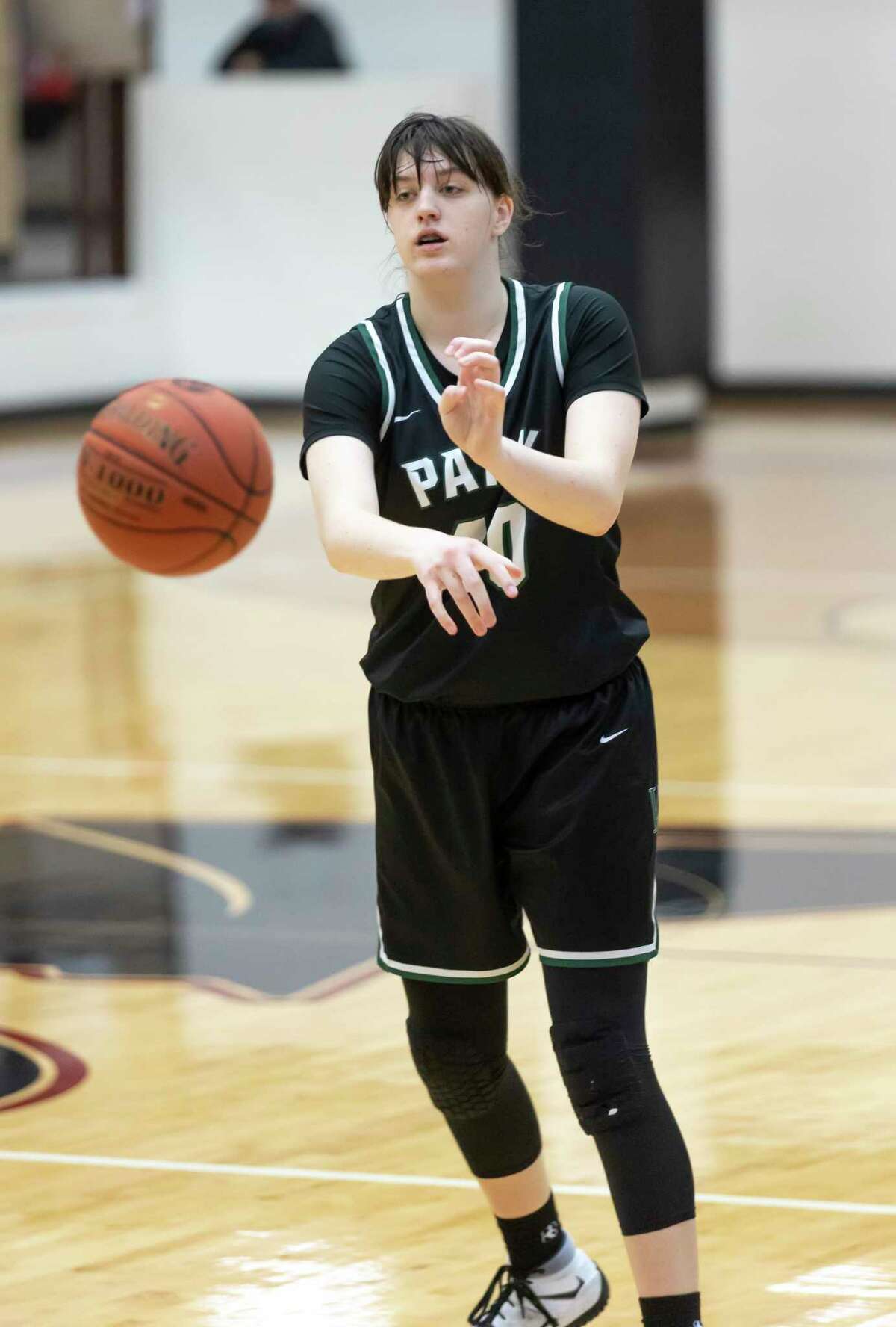 Kingwood Park guard Melina Merritt (10) passes the ball during the second quarter of a District 20-5A girls basketball game against Porter at Porter High School, Saturday, Feb. 6, 2021 in Porter.