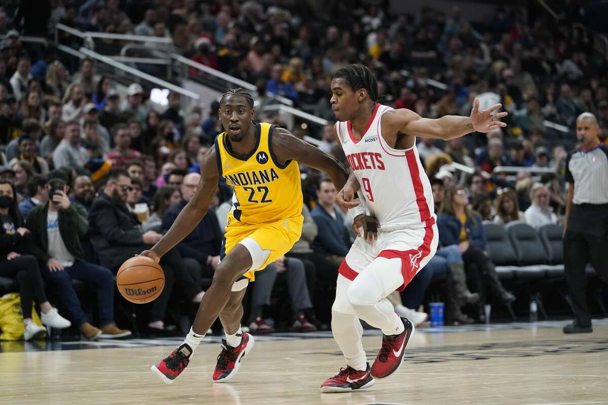 Indiana Pacers' Caris LeVert (22) goes to the basket against Houston Rockets' Josh Christopher (9) during the second half of an NBA basketball game, Thursday, Dec. 23, 2021, in Indianapolis. (AP Photo/Darron Cummings)