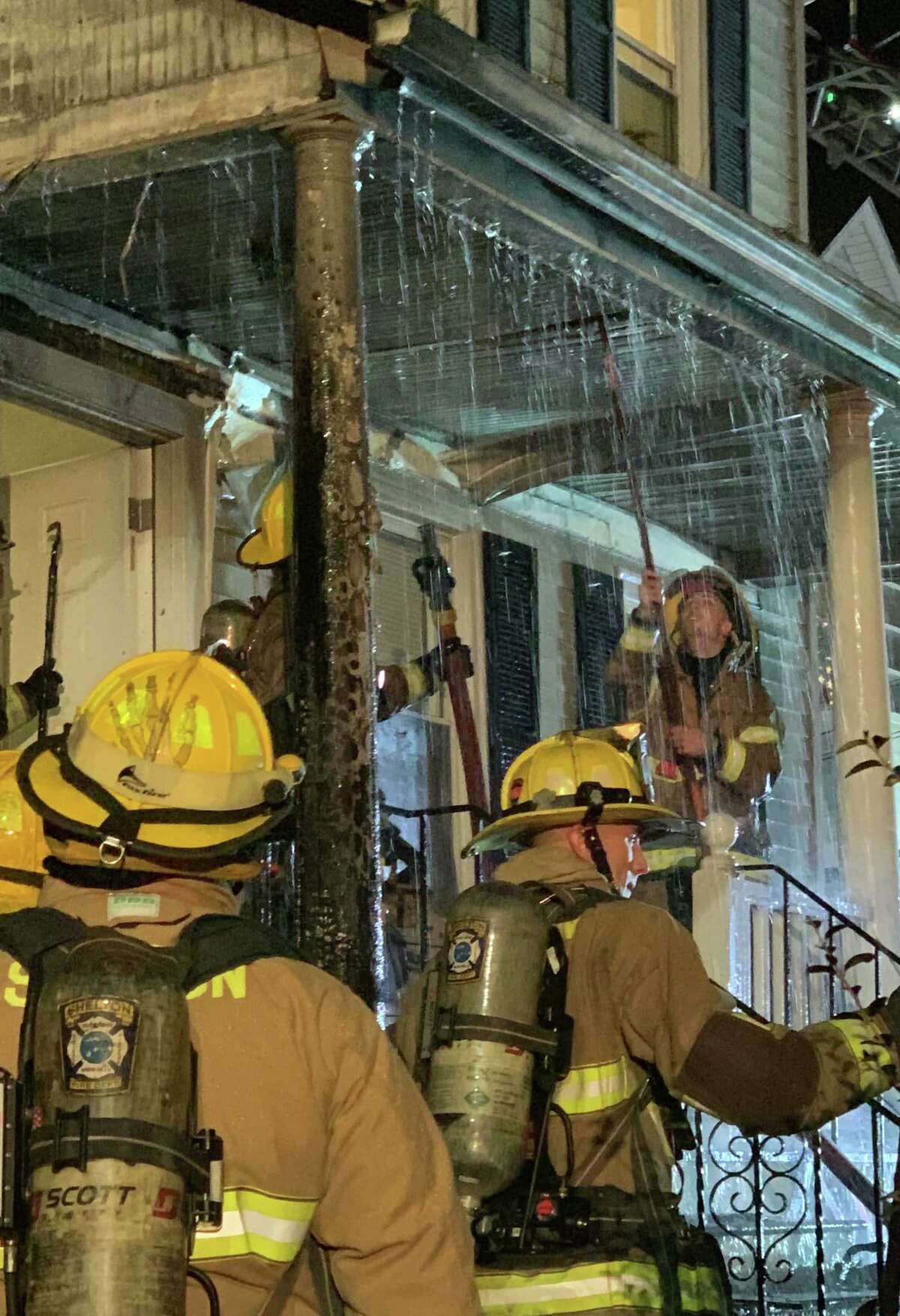 A porch fire at a Charles Street home in Shelton, Conn., on Thursday, Dec. 23, 2021, spread slightly inside on the first floor, according to fire officials.
