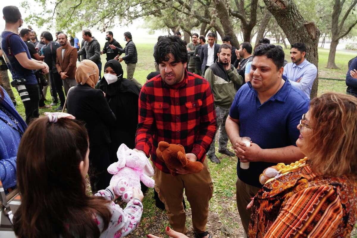 Riaz Saroar Khil accepts stuffed animals during a vigil Friday morning at the St. Francis Pavillion for his missing 3 year old daughter Lina Sardar Khil.